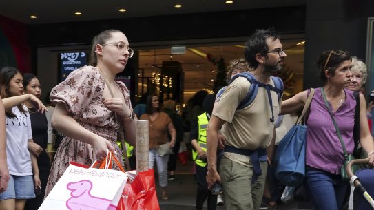 ’Tis the season to be gloomy: Shoppers on Melbourne’s Bourke Street Mall.