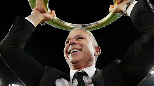 Sydney FC coach Steve Corica with the trophy after winning last season's A-League grand final.