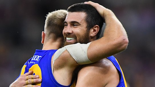 Oscar Allen and Josh Kennedy celebrate a goal.