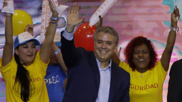 Ivan Duque, Colombian presidential candidate for the Democratic Centre, waves to supporters on Sunday.