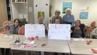 Residents show posters reading "Thank you for everything". 