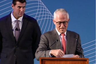 Ben Roberts-Smith stands behind then-Prime Minister Malcolm Turnbull at an awards ceremony at  Parliament House on March 28, 2018. 
