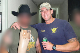 Ben Roberts-Smith and friend with a novelty drinking vessel made from the prosthetic leg of an Afghan man.
