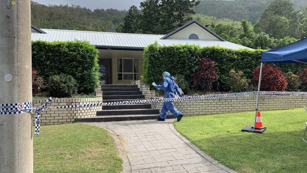 Detectives and forensic officers examining the Frenchville home on Tuesday morning.