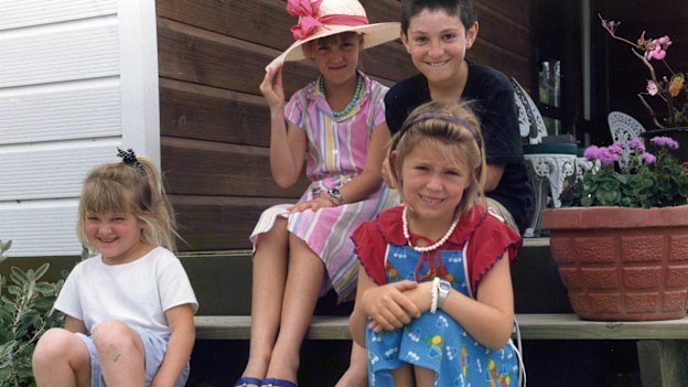 Jacinda (at front, in red and blue) with her sister Louise (in hat) and cousins Demelza and Aaron in 1987.