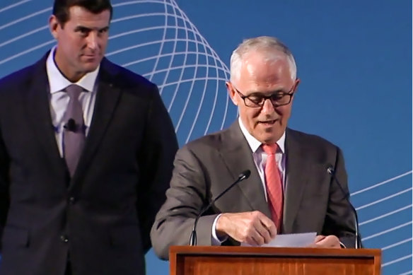 Ben Roberts-Smith stands behind then-Prime Minister Malcolm Turnbull at an awards ceremony at  Parliament House on March 28, 2018. 