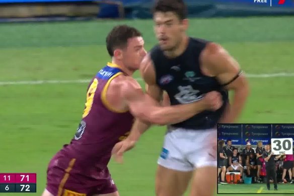 Carlton’s George Hewitt and Brisbane’s Lachie Neale clash at the Gabba.