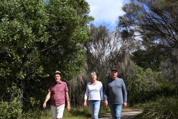 Landscape plan opponents Michael Upston (left) and Jenny Date with her husband, Kerry, walk along the foreshore track at Corinella.