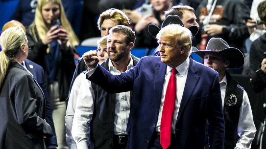 Former President Donald Trump greets fans as he arrives before the finals during the NCAA Wrestling Championships on Saturday, March 18 in Tulsa, Oklahoma.