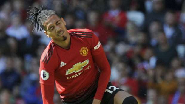 Chasm: Manchester United defender Chris Smalling reacts during their home loss to relegated Cardiff City.