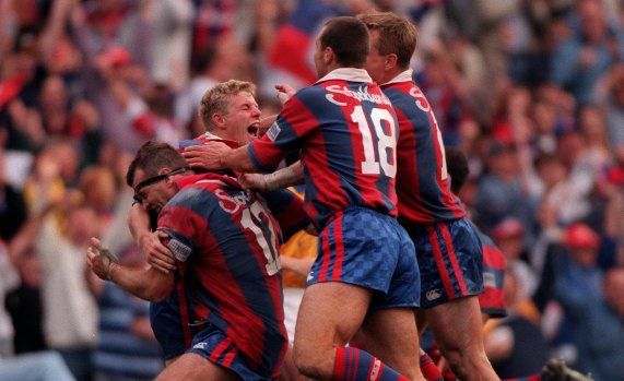 Prince Albert: Darren Albert and the Knights celebrate an improbable grand final victory in 1997.
