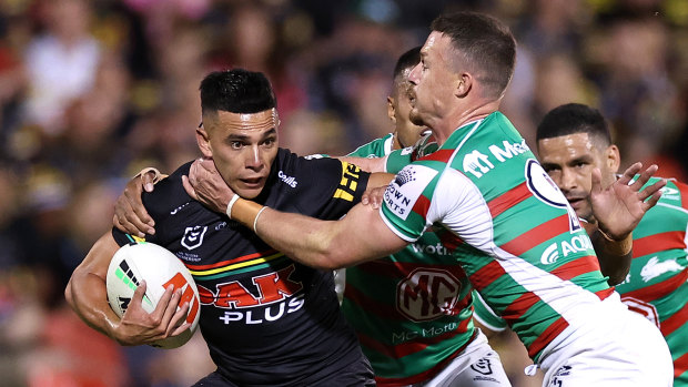 Penrith Panthers hooker Soni Luke tries to avoid South Sydney Rabbitohs rival Damien Cook.