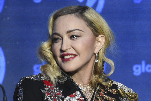 Madonna has been accused of false advertising by two people who attended her December concert in New York.