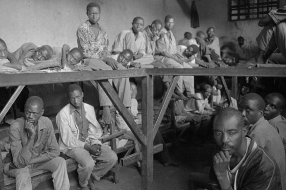 Inmates accused of war crimes sit in a prison at Kibungo in August 1994. Survivors of the Rwandan genocide say reconciliation cannot be achieved whilst those convicted of war crimes refuse to provide information about burial sites.