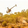 Two Robinson helicopters similar to the one pictured have collided in WA’s far north.