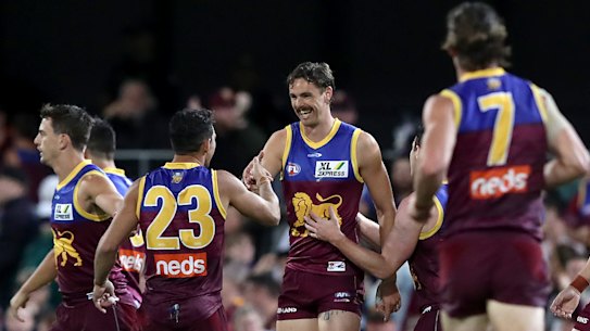 BRISBANE, AUSTRALIA - APRIL 17: Joe Daniher of the Lions celebrates a goal during the round five AFL match between the Brisbane Lions and the Essendon Bombers at The Gabba on April 17, 2021 in Brisbane, Australia. (Photo by Jono Searle/AFL Photos/via Getty Images )