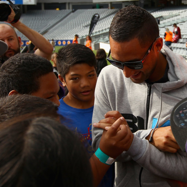 Benji Marshall is mobbed by young fans when he returned home to New Zealand for a Test match in 2012.