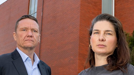 Parents James Rankin and Hannah Marshall outside Collingwood College, which has water damage on the whole top floor.