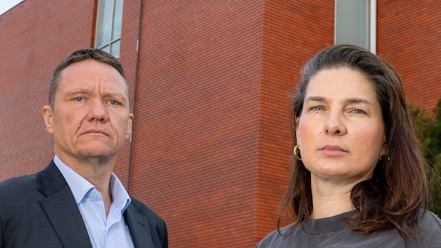 Parents James Rankin and Hannah Marshall outside Collingwood College, which has water damage on the whole top floor.