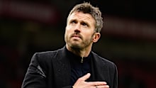 Michael Carrick reacts to supporters after his team lost.
