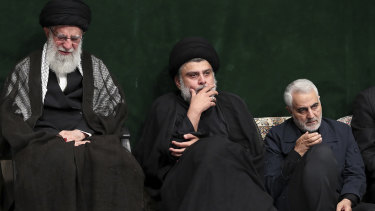 Supreme Leader Ayatollah Ali Khamenei, left, Iraqi Shiite cleric Muqtada al-Sadr, centre, and commander of Iran's Quds Force, Qassem Soleimani attend a mourning ceremony in September.