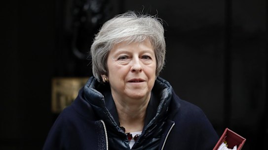 British Prime Minister Theresa May leaves 10 Downing Street in London, to attend Prime Minister's Questions at the Houses of Parliament, Wednesday, Nov. 21, 2018. (AP Photo/Matt Dunham)