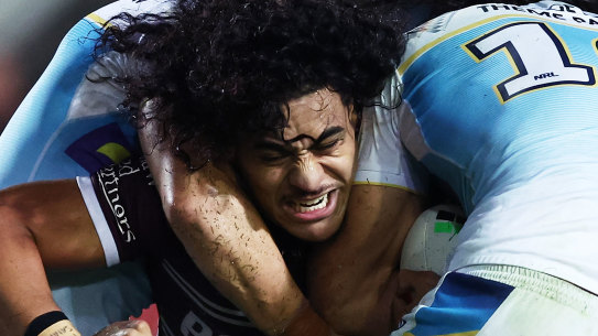 Christian Tuipulotu is tackled. (Photo by Matt King/Getty Images)