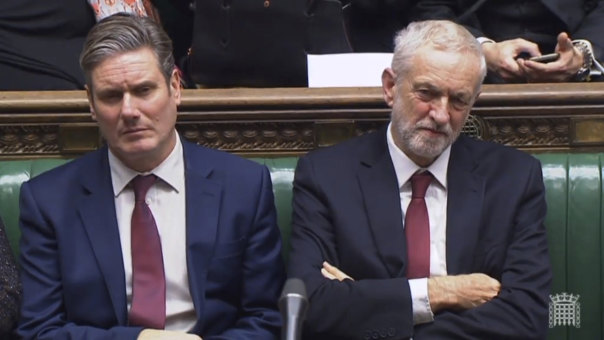 Opposition spokesperson for Brexit, Keir Starmer, and Labour leader Jeremy Corbyn listen to Prime Minister Theresa May's statement on Brexit in the House of Commons on November 26.
