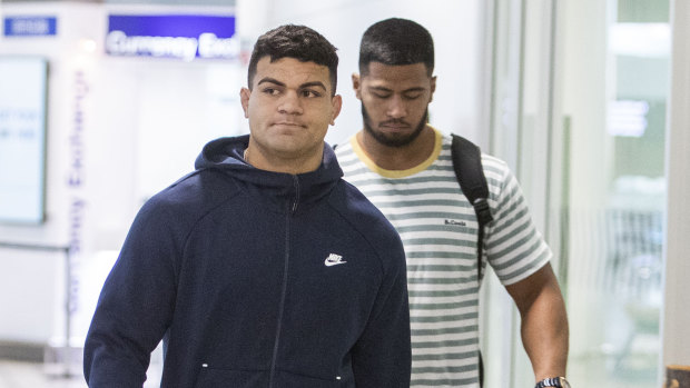 David Fifita and Payne Haas arrive back in Australia after the former was arrested while on holiday in Bali.