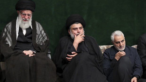 Supreme Leader Ayatollah Ali Khamenei, left, Iraqi Shiite cleric Muqtada al-Sadr, centre, and commander of Iran's Quds Force, Qassem Soleimani attend a mourning ceremony in September.