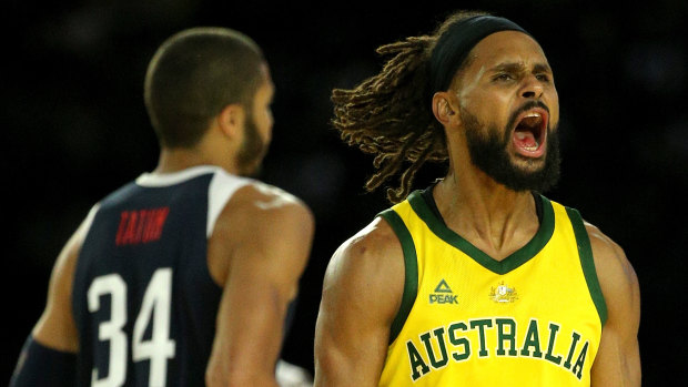 In the zone: Patty Mills celebrates another bomb against Team USA.