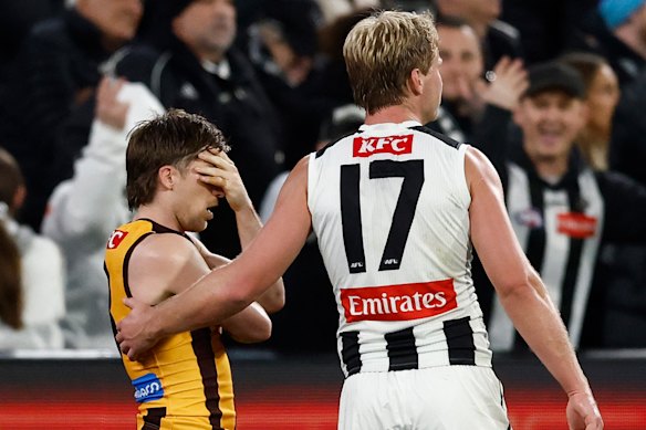 Dylan Moore is consoled by Frampton after missing his shot after the siren in the second draw of the year between the two teams.