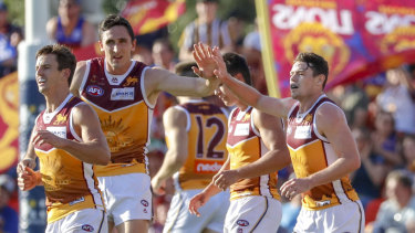 Brisbane's Lachie Neale celebrates a goal during the clash against the Gold Coast Suns.