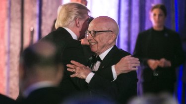 Rupert Murdoch embraces President Trump in 2017 at a dinner honoring veterans who served in the Battle of the Coral Sea.