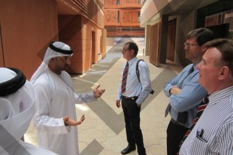 Paul Pisasale, centre, and colleagues in Masdar City, Abu Dhabi.