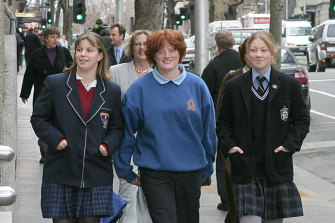 Ms Holdstock (in a pale grey suit) walks into VCAT behind teenagers Helen Taylor, Emily Stanyer and Penny Cula-Reid, who she represented in 2003  when they took on Football Victoria to fight for their right to play.