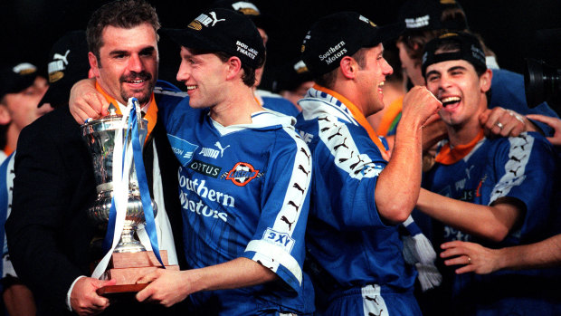 Postecoglou (left) in 1998 after coaching South Melbourne to a win over Carlton in the NSL grand final.