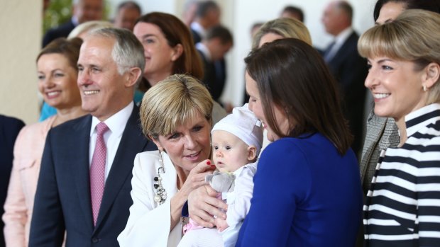 Happier times ... Kelly O'Dwyer and daughter Olivia joined the women in the ministry in a photo with then Prime Minister Malcolm Turnbull and his deputy, Julie Bishop, after the swearing-in ceremony in 2015. 