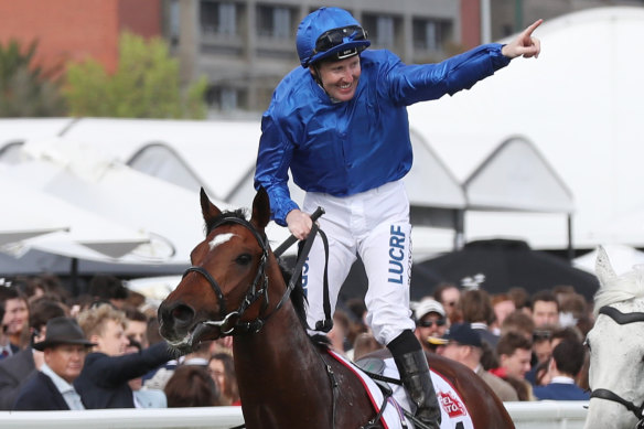 Jockey Pat Cosgrove celebrates with the crowd after winning the Caulfield Cup last year on Best Solution.