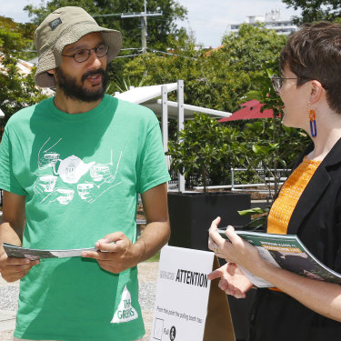Jonathan Sri (left, pictured with South Brisbane Greens MP Amy MacMahon on state election day) says it is hard for smaller parties to attract working-class candidates.