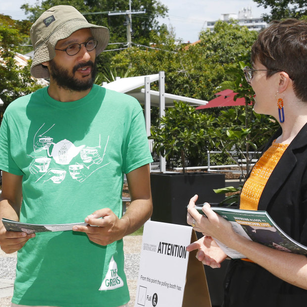 Jonathan Sri (left, pictured with South Brisbane Greens MP Amy MacMahon on state election day) says it is hard for smaller parties to attract working-class candidates.