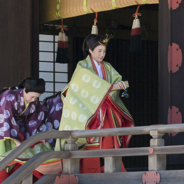 Empress Masako on her way to report the date of her husband's enthronement ceremony  to the imperial ancestors in May.