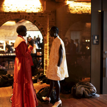 Models get ready to hit the runway.