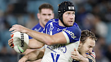 SYDNEY, AUSTRALIA - MAY 22: Matt Burton of the Bulldogs is tackled during the round 12 NRL match between Canterbury Bulldogs and Melbourne Storm at Accor Stadium, on May 22, 2026, in Sydney, Australia. (Photo by Darrian Traynor/Getty Images)