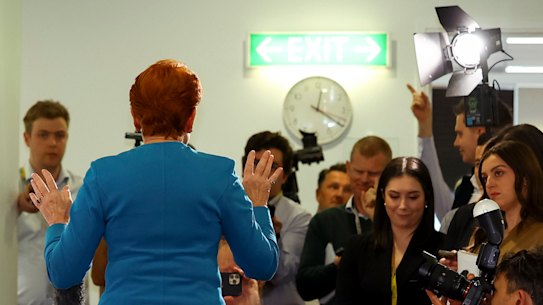 Hanson casts a long shadow in front of the press.