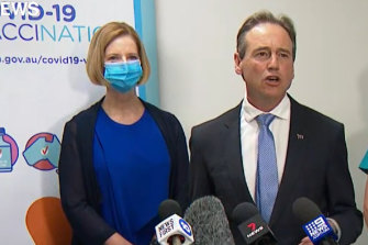 Federal Health Minister Greg Hunt with former prime minister Julia Gillard (left) at a press conference on Sunday after the pair received the AstraZeneca vaccine.