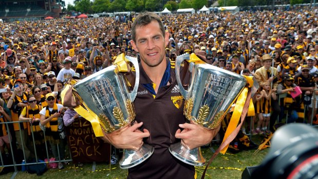 Glory days: Former Hawthorn captain Luke Hodge with the 2014 and 2013 Premiership trophies at Glenferrie oval in Melbourne.