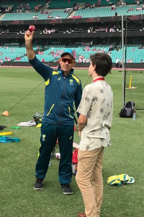 Riley receives from tips from Australia coach Justin Langer.