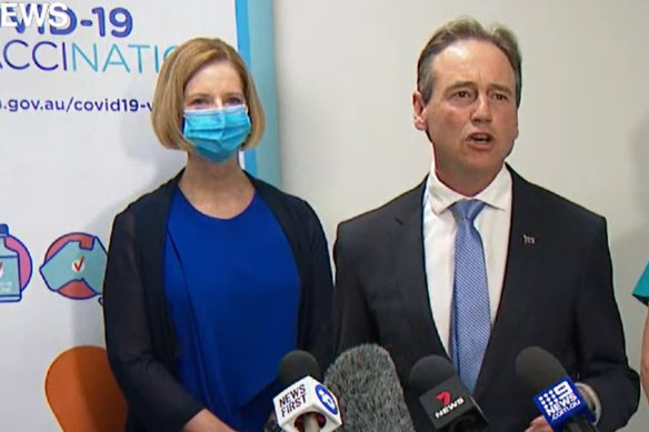 Federal Health Minister Greg Hunt with former prime minister Julia Gillard (left) at a press conference on Sunday after the pair received the AstraZeneca vaccine.