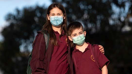 Blackburn Primary School students Alice, 9, and her brother Ben, 6, are happy to mask up at school.